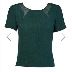 A. Moss green silk top with back zip detail
